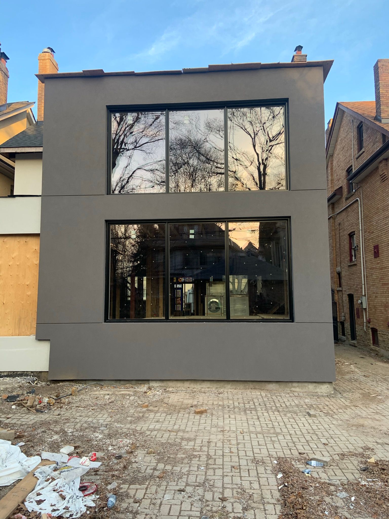 A large building with a lot of windows is being built