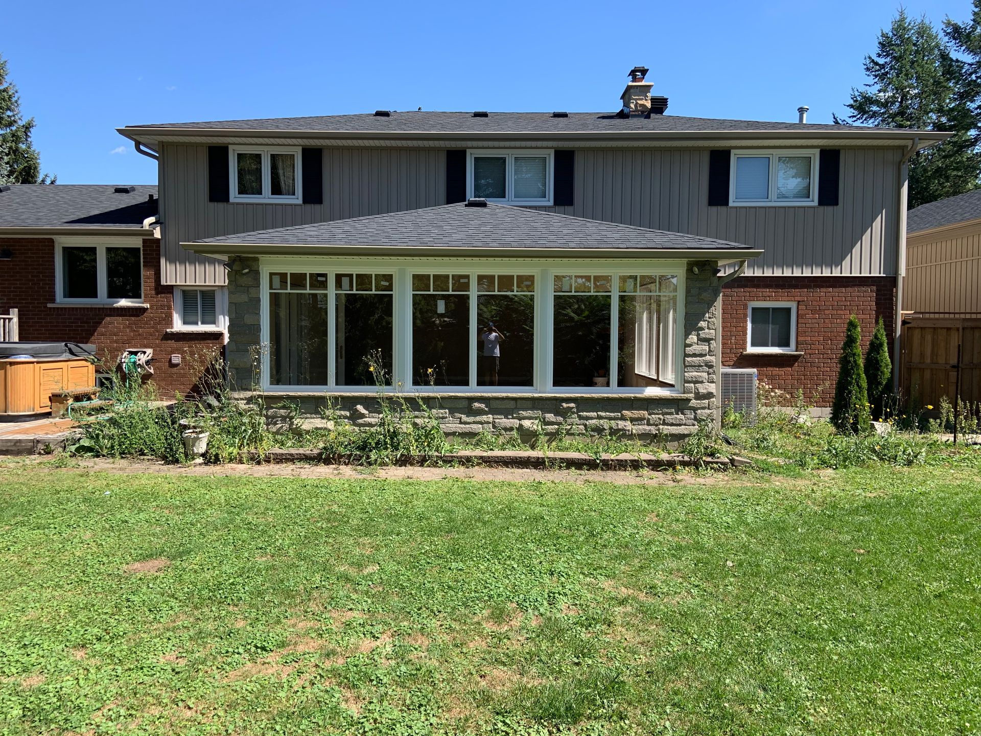A large house with a large lawn in front of it.