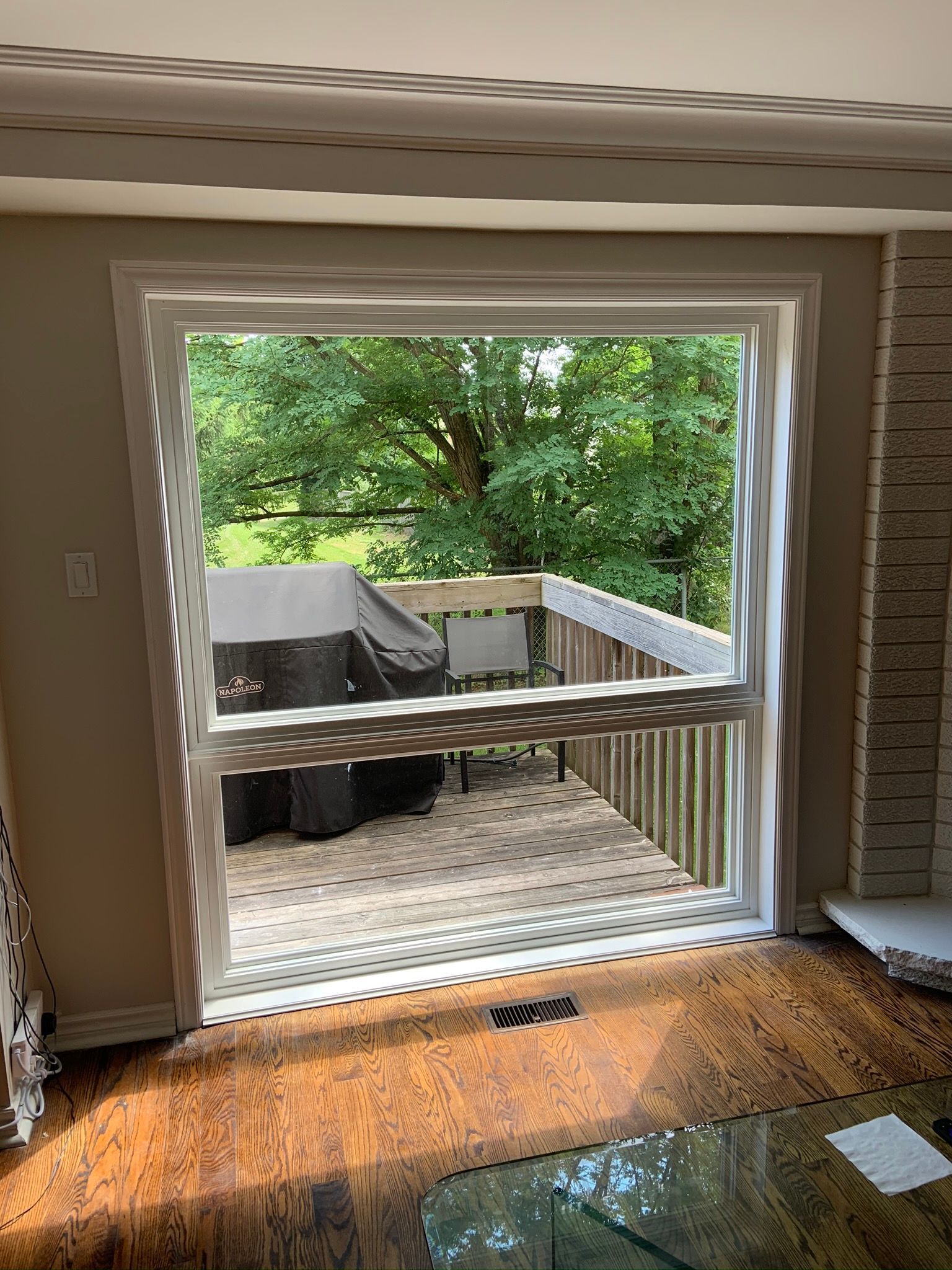 A living room with a sliding glass door leading to a deck.