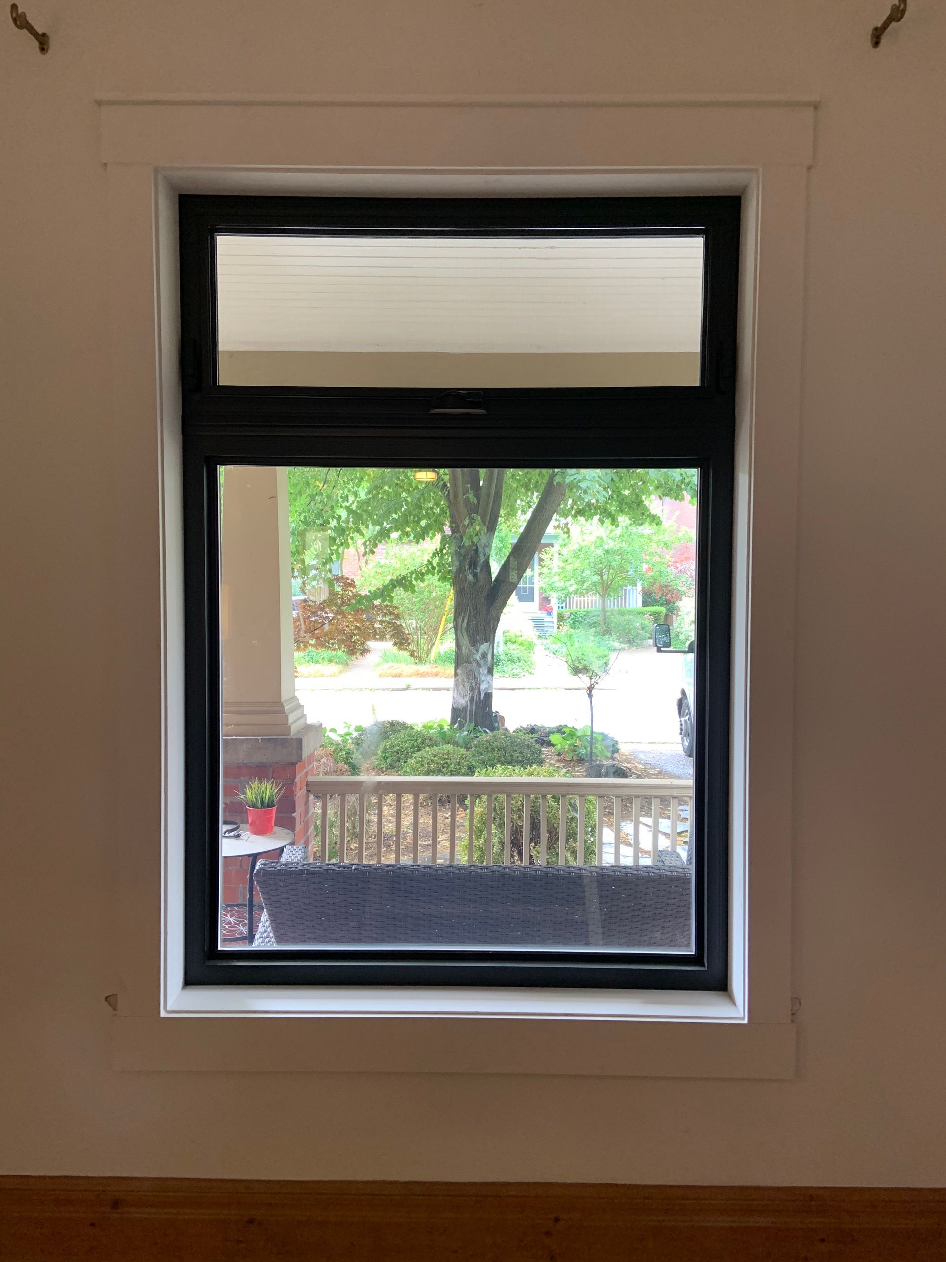 A window in a room with a view of a tree.