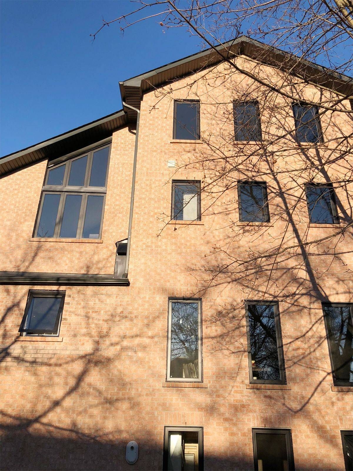 A large brick building with a blue sky in the background
