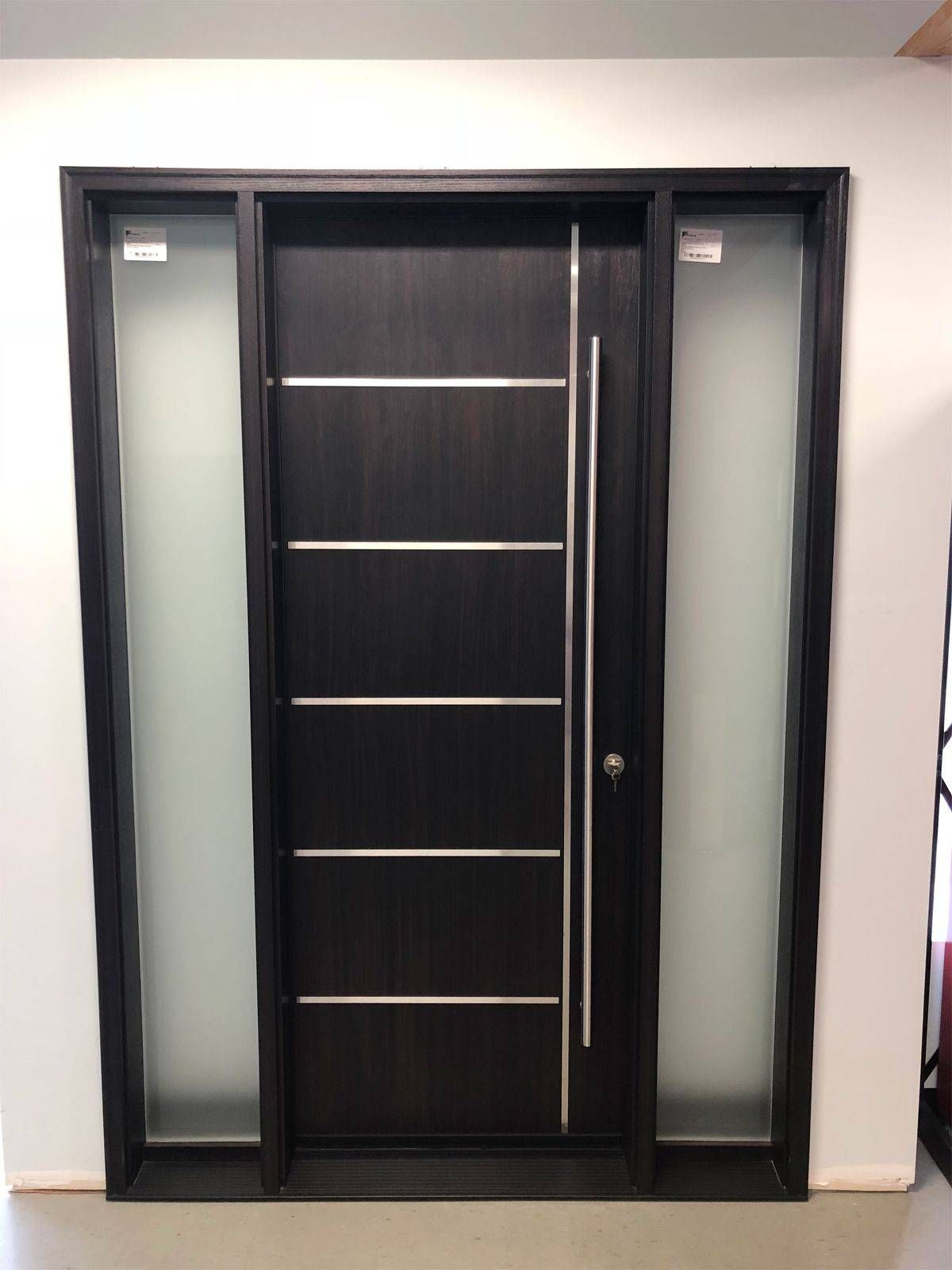 A black door with a stainless steel handle