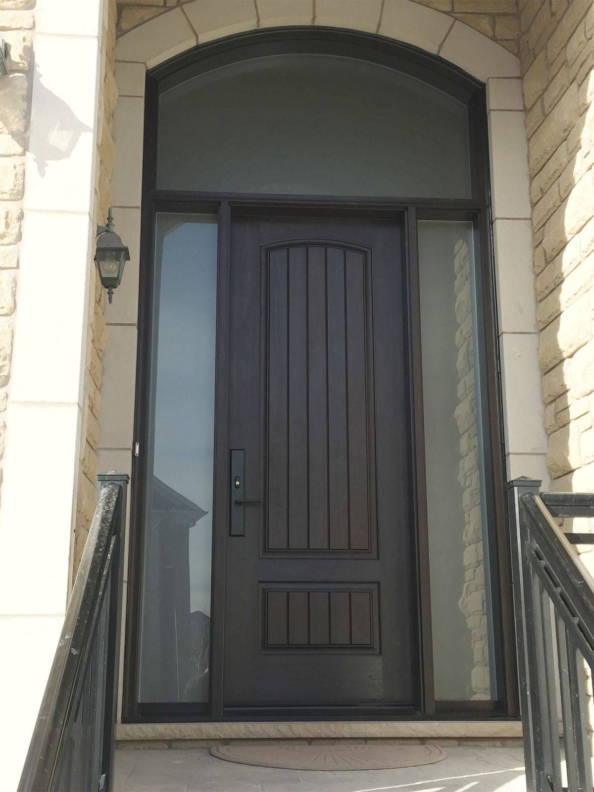 The front door of a house with a sliding glass door.