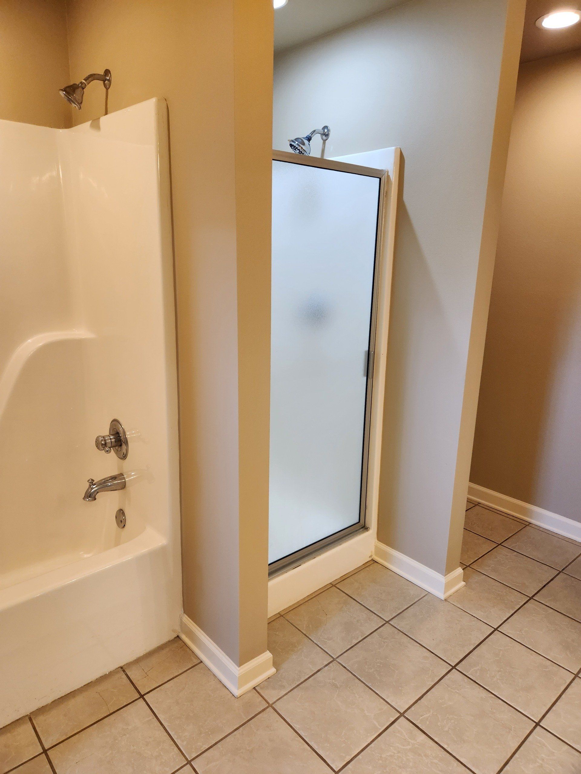 Bathroom with tub and shower