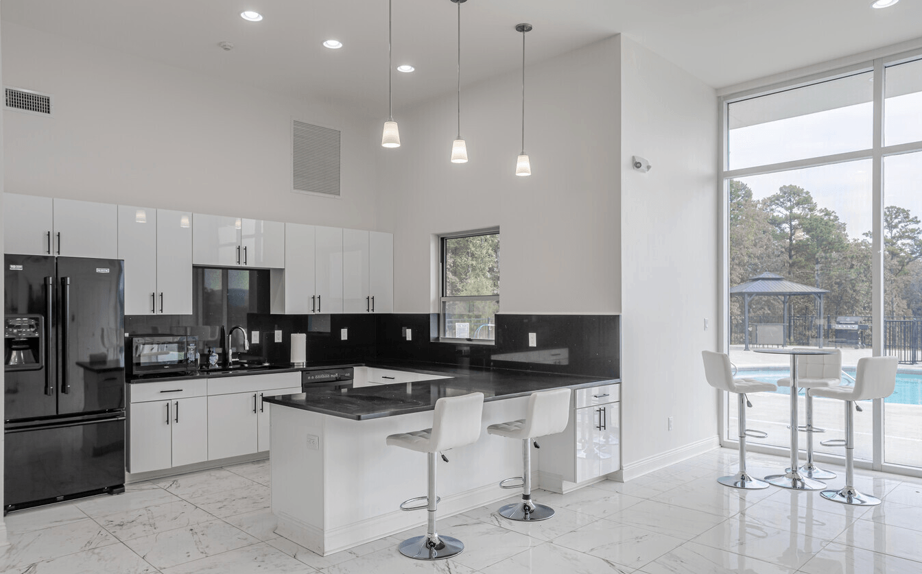 Interior of kitchen with white cabinetry