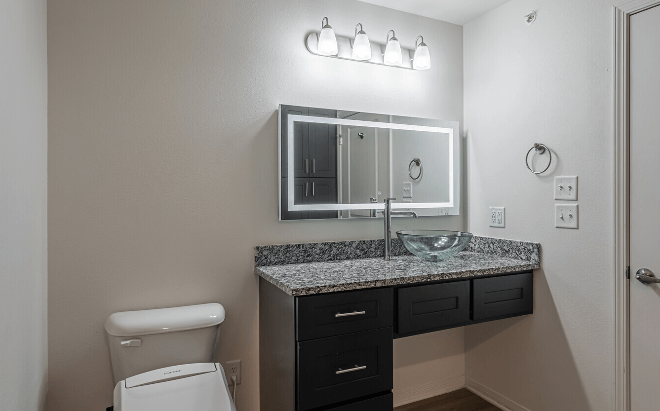 Interior of bathroom with light-up vanity mirror