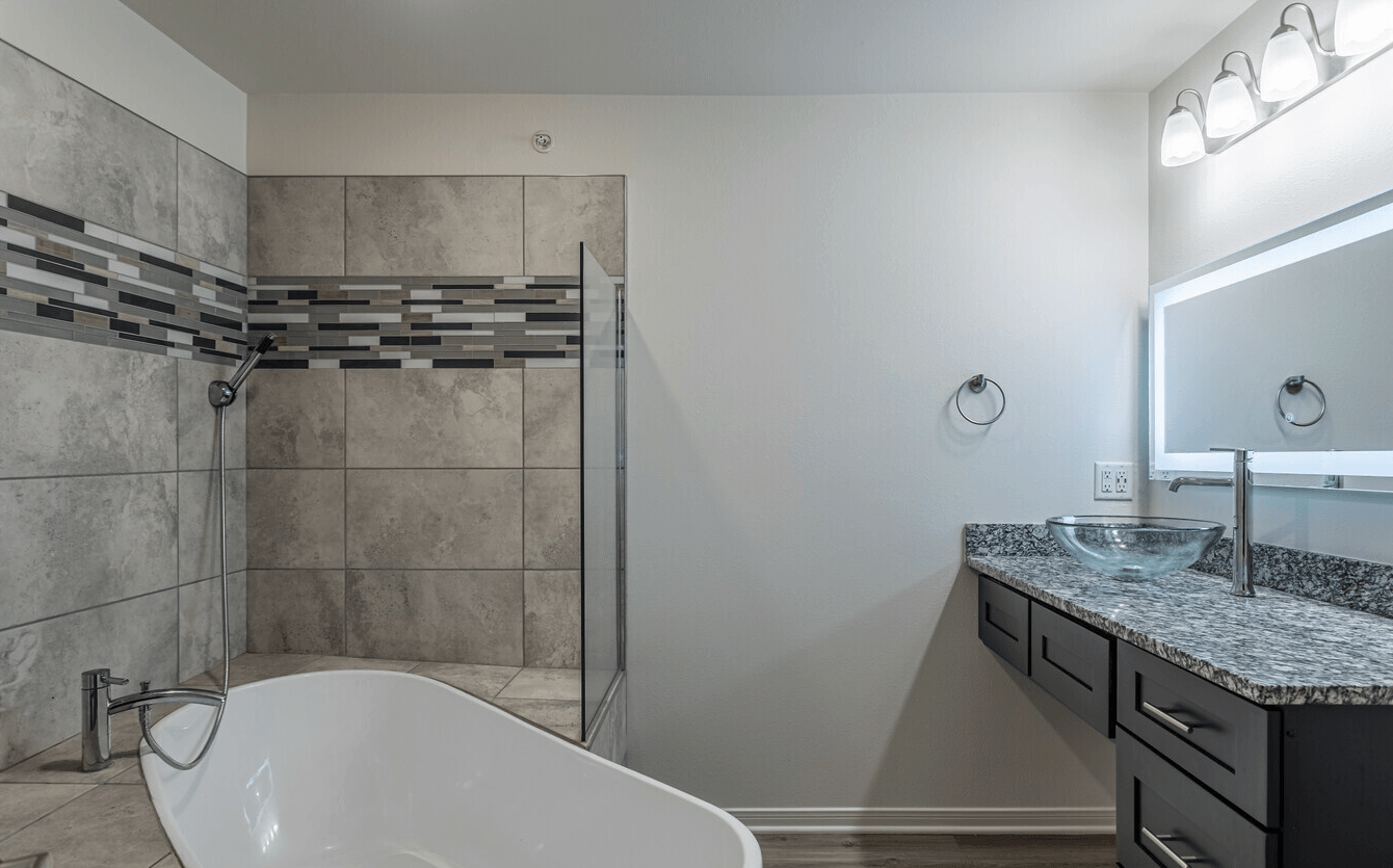 Interior of bathroom with large garden style tub