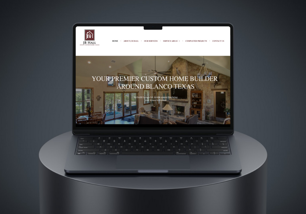 Laptop displaying a website for a custom home builder in Blanco, Texas.
