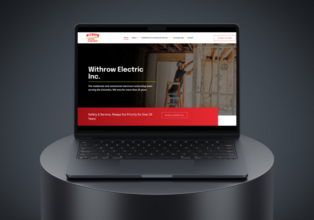 Hand holding a phone displaying the Google Ads logo against a blurred background of a computer screen with charts.