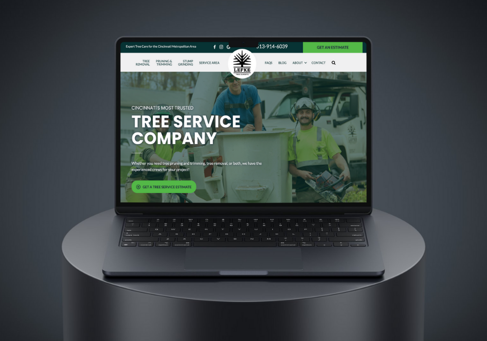 Laptop displaying a tree service company website.