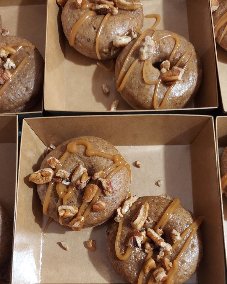 A person is stirring a strawberry milkshake with a straw.