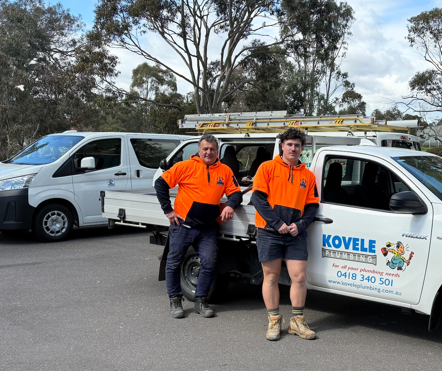 Steve Kovac, a Melbourne Plumber in a green shirt is standing in front of a white van that says 