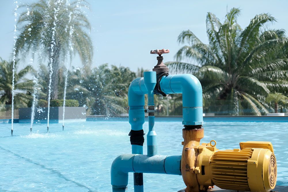 A Lowara Pump Is Sitting Next To A Swimming Pool — Jobec Pumps & Irrigation In Murwillumbah, NSW 