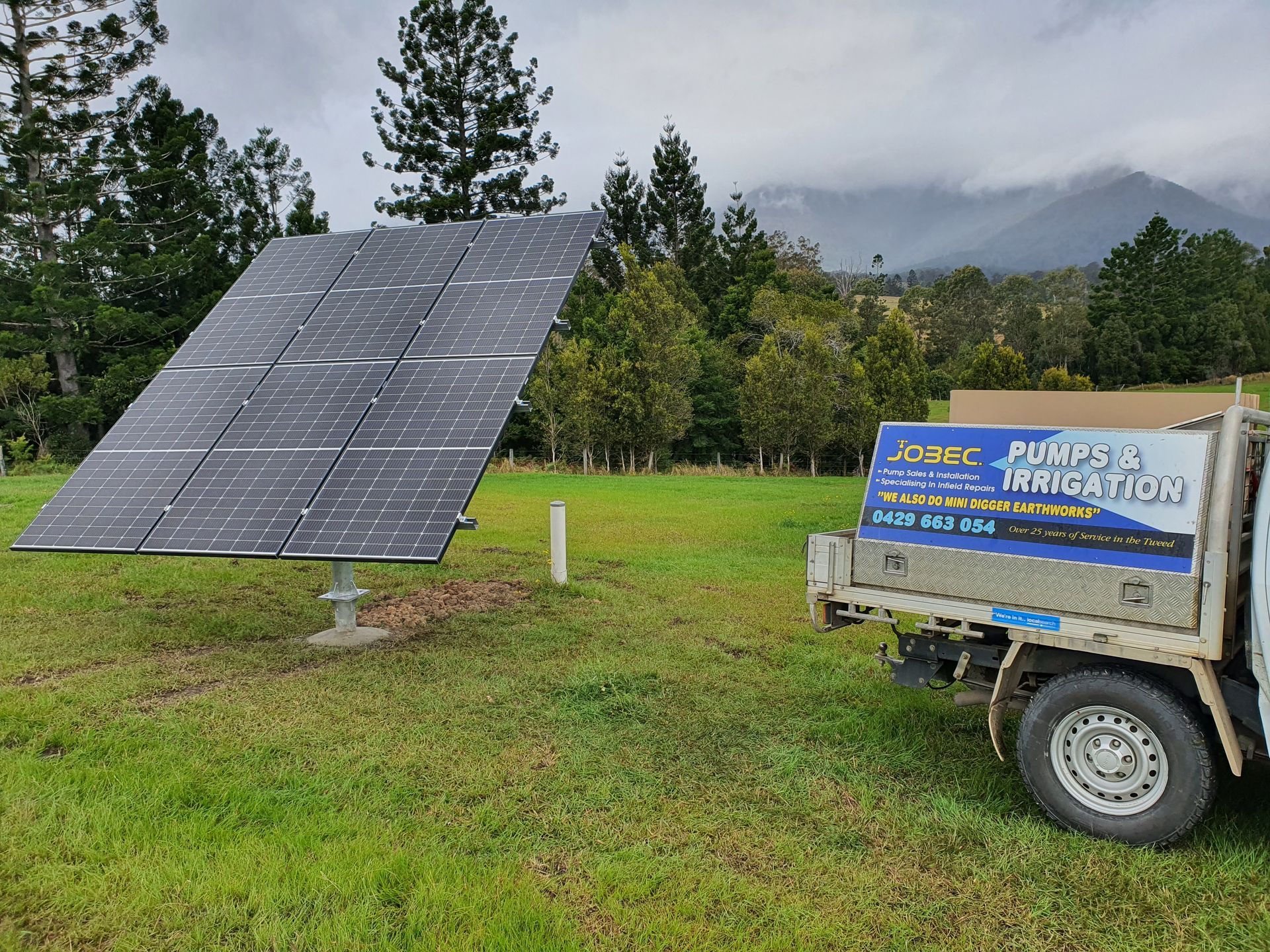 Man Is Making Sure That The Water Pump Is Properly Install For Client — Jobec Pumps & Irrigation In Murwillumbah, NSW