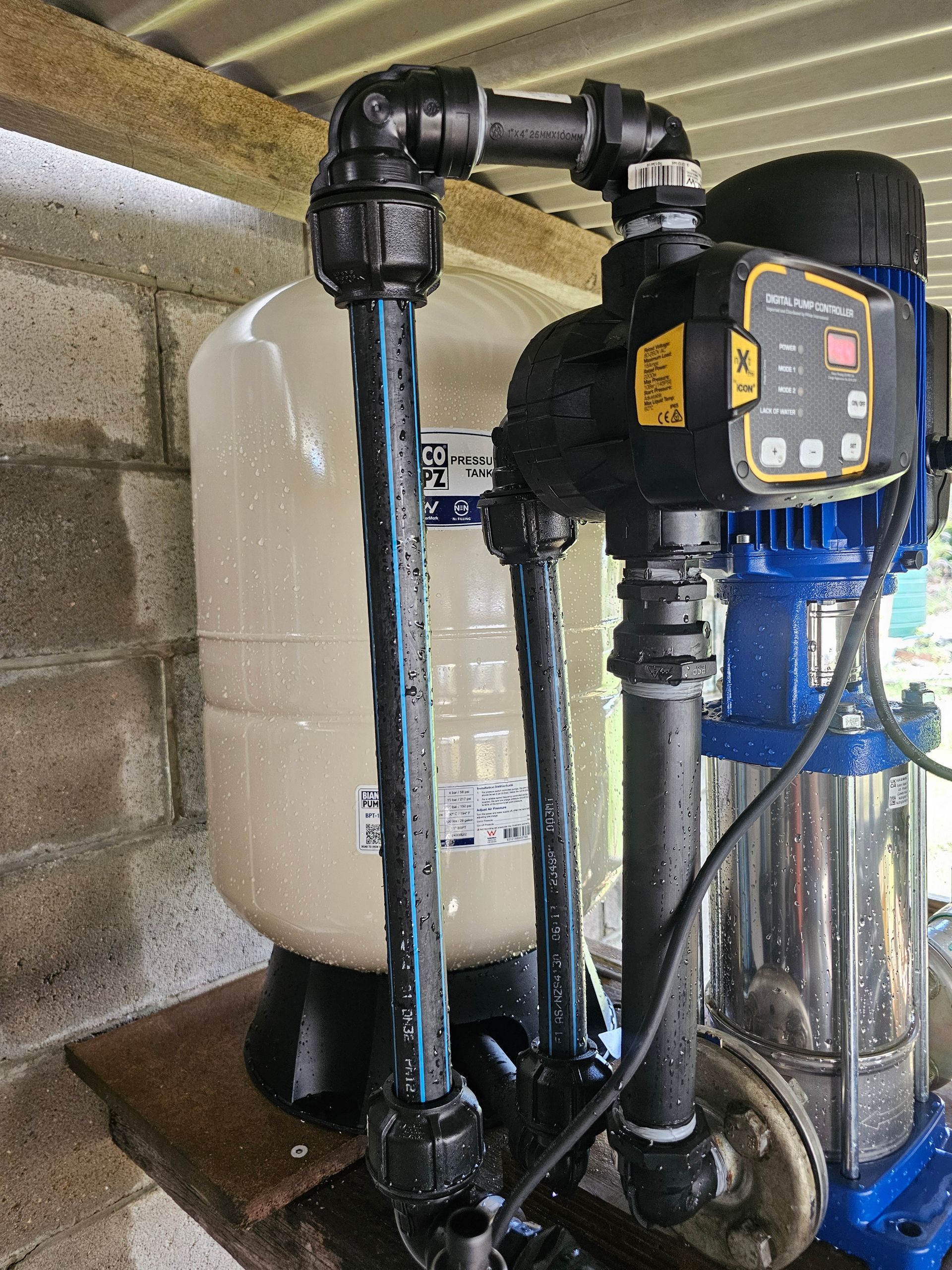 A Person Is Installing Water Pump — Jobec Pumps & Irrigation In Murwillumbah, NSW