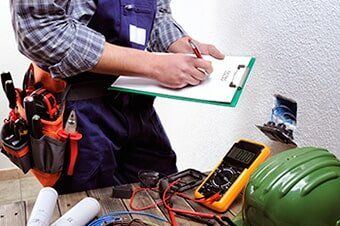 Electrician Working in Electrical Installation — Home Repairs in Hampton, VA