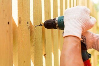 Carpenter Repairing Fences — Office Improvement in Hampton, VA