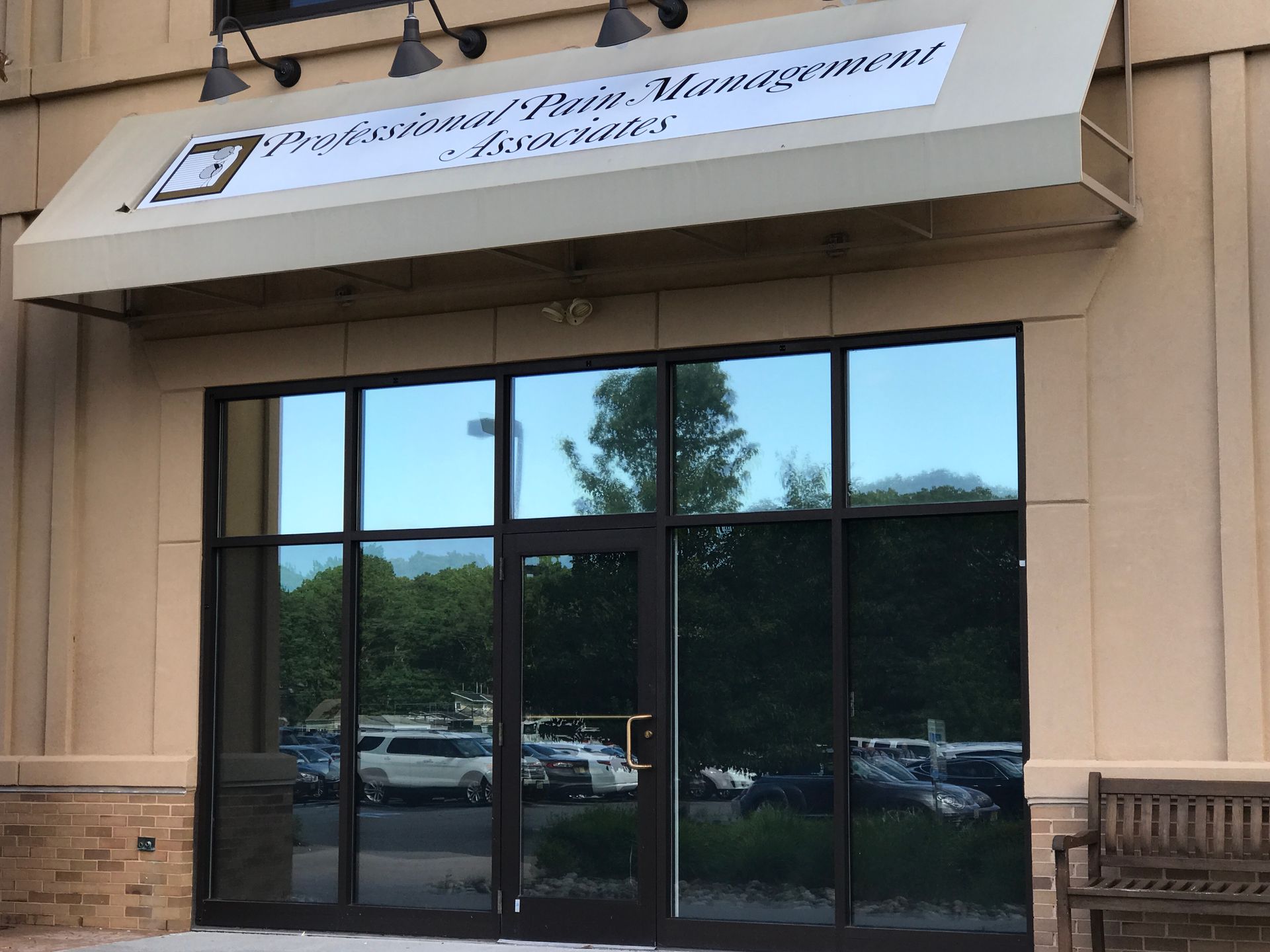 The front of a building with a white awning over the door