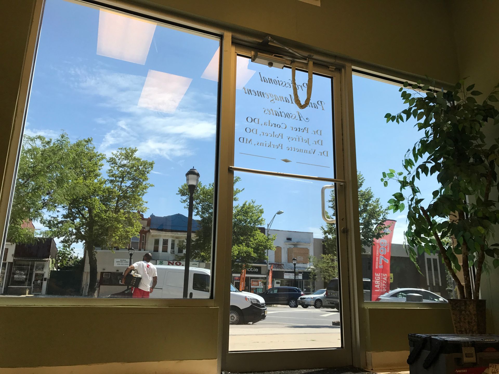 A window with a sign on it that says ' welcome '