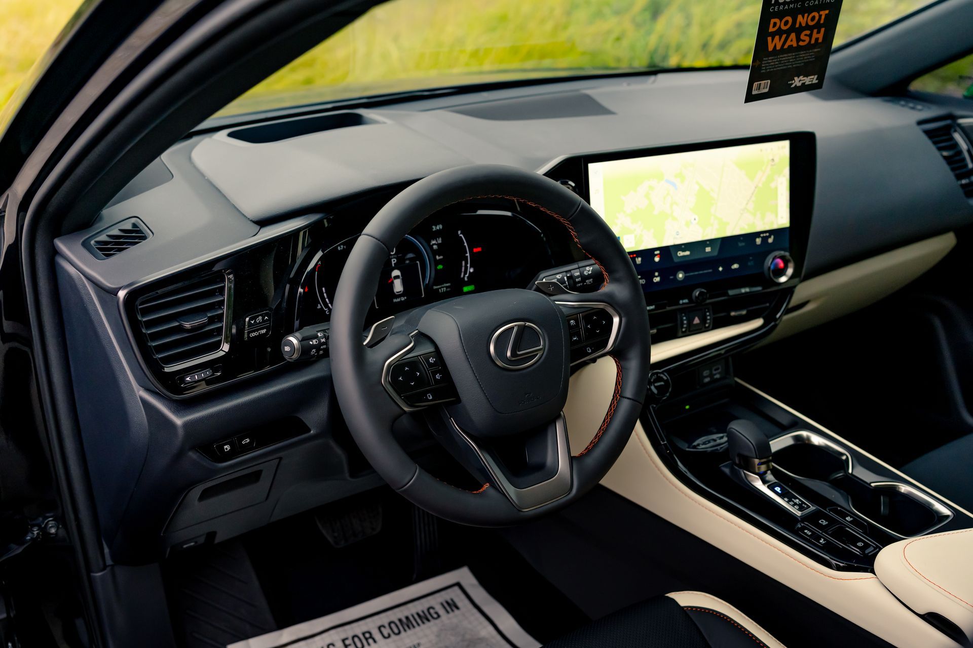 The interior of a lexus nx is shown with a steering wheel and dashboard.