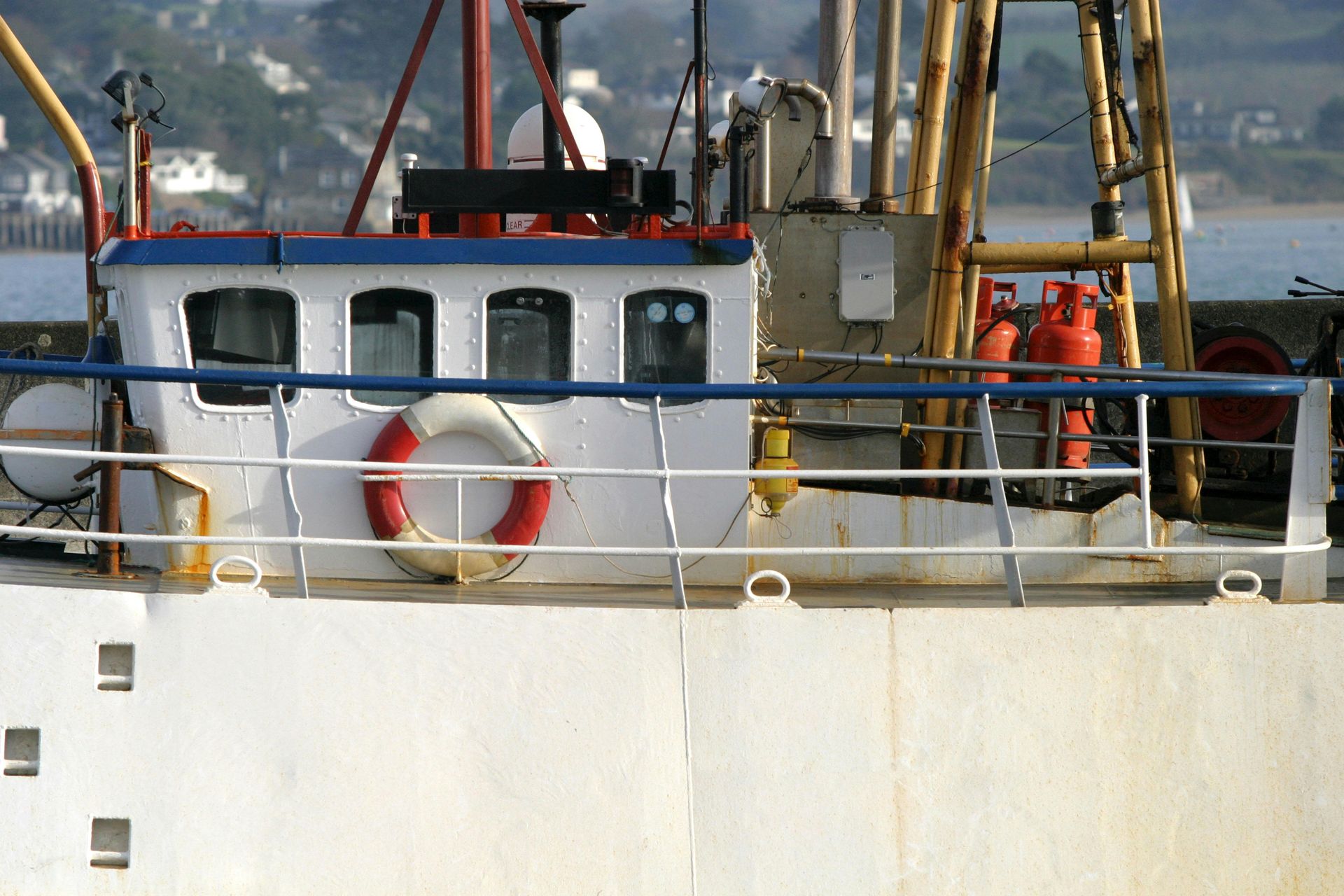 A boat with a life preserver on the side of it