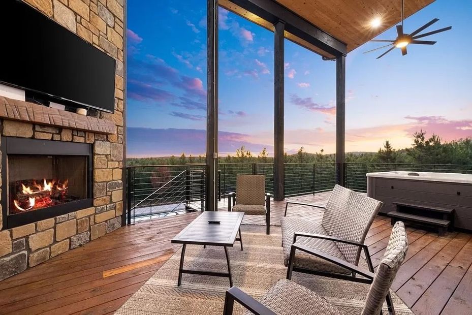 There is a fireplace and a hot tub on the deck.