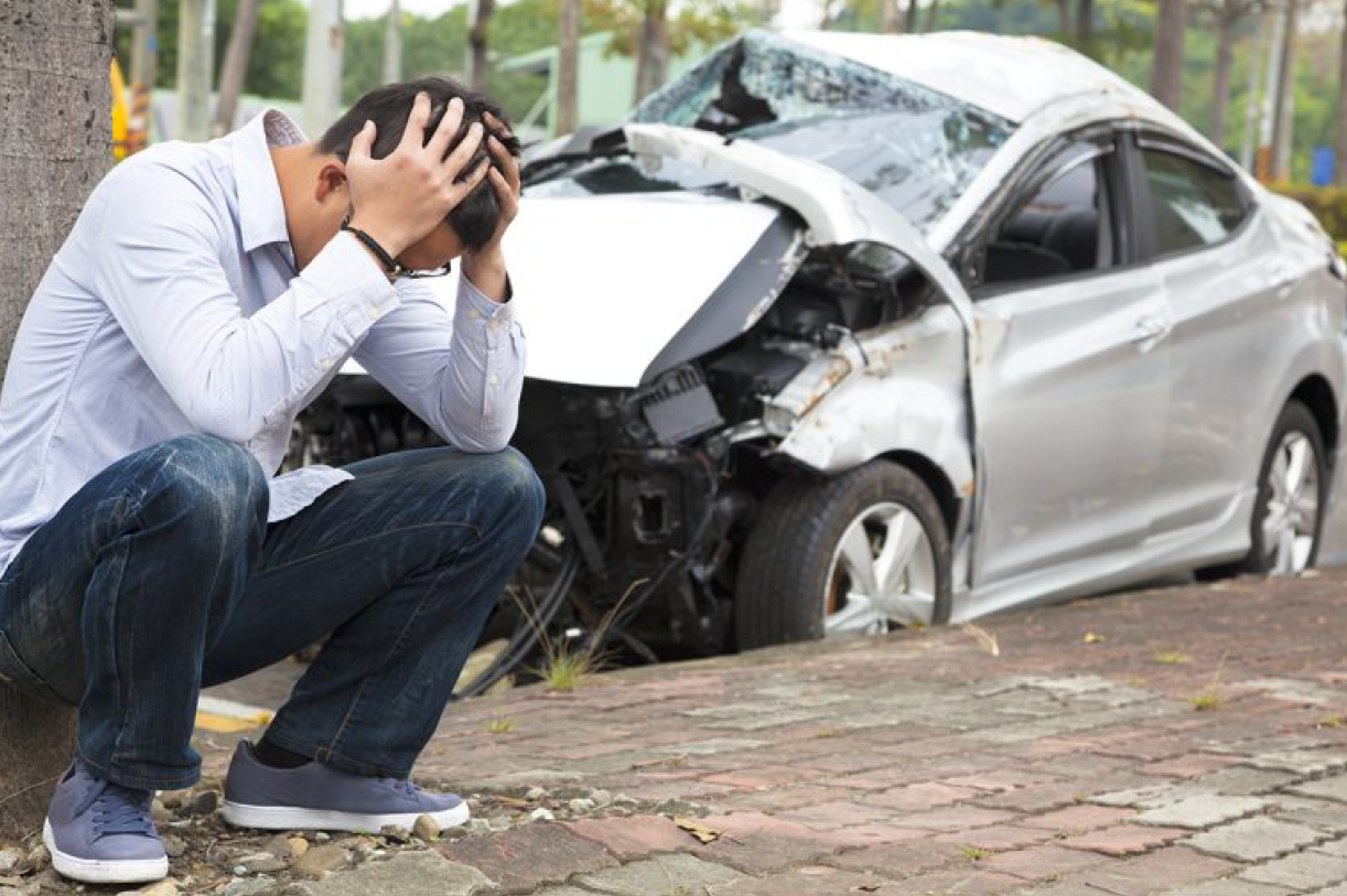 A Man and a Damaged Car — Florissant, MO — Teague & Associates, LLC