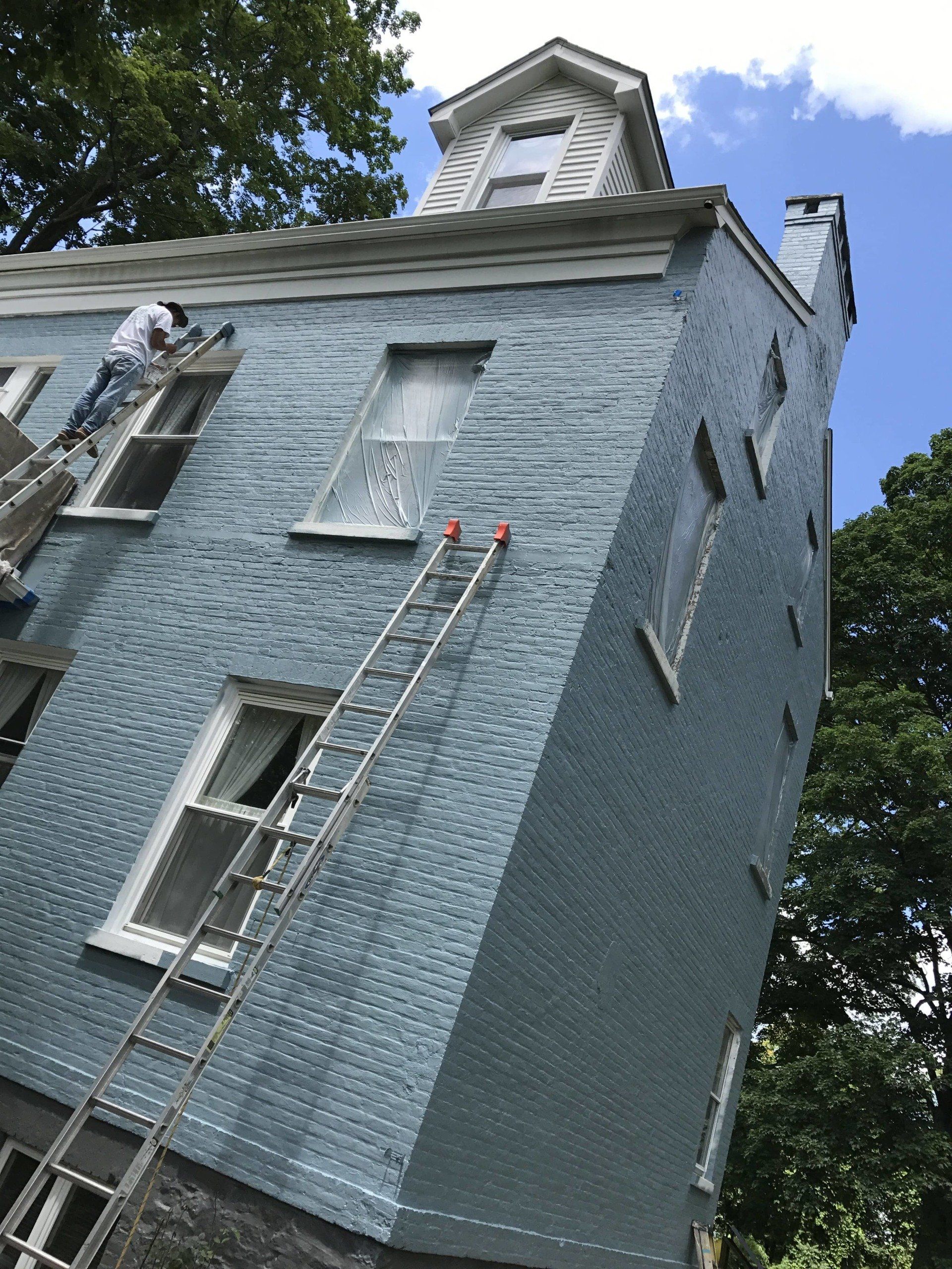 Painters painting window trim - Exterior House Painting in Wappingers Falls, NY