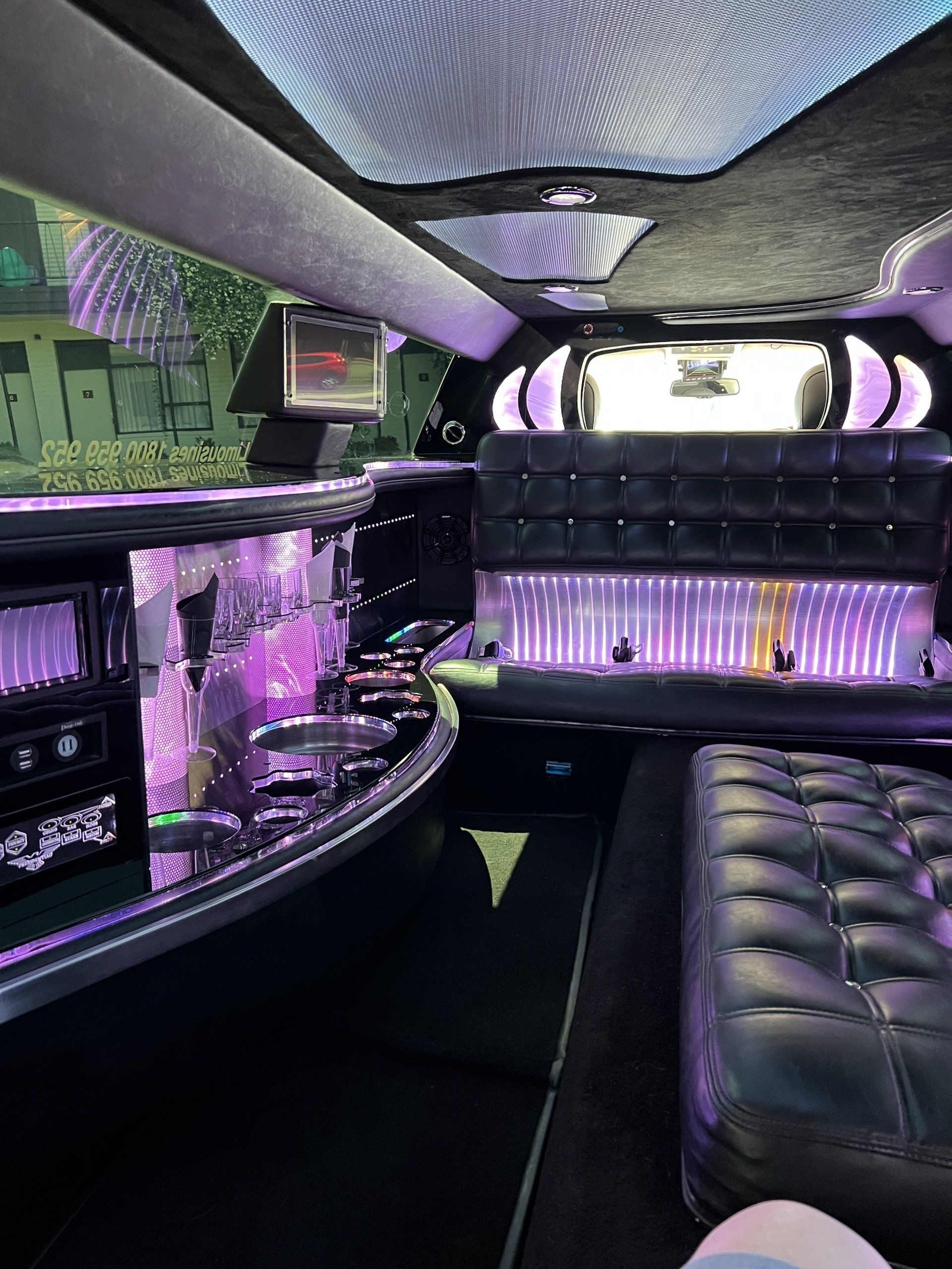 Couple taking photos in limousine — Limousine Hire in Newcastle, NSW