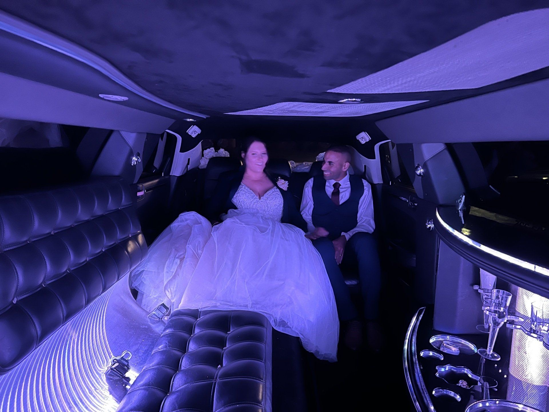 Couple smiling in limousine — Limousine Hire in Central Coast, NSW