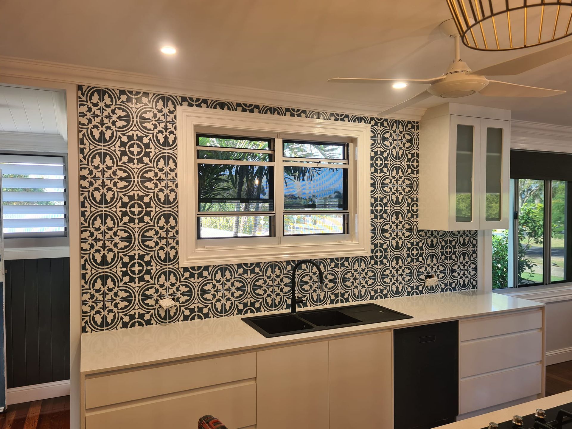 Modern Kitchen With White Cabinets, Patterned Backsplash — Tropic Tiling in Tolga, QLD