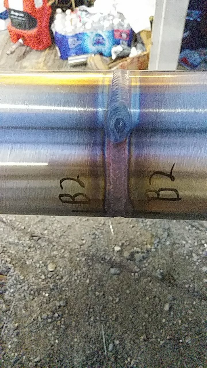 A close up of a metal pipe with numbers on it.
