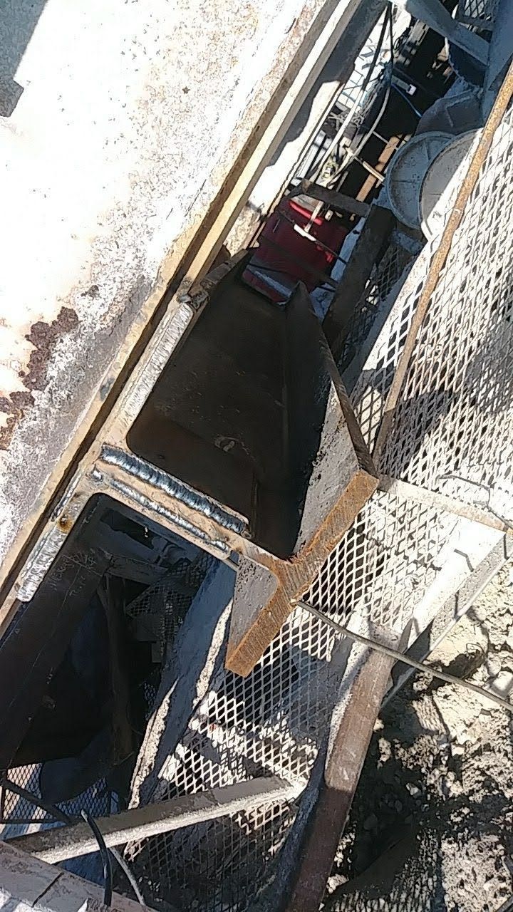 An aerial view of a manhole cover on a construction site.