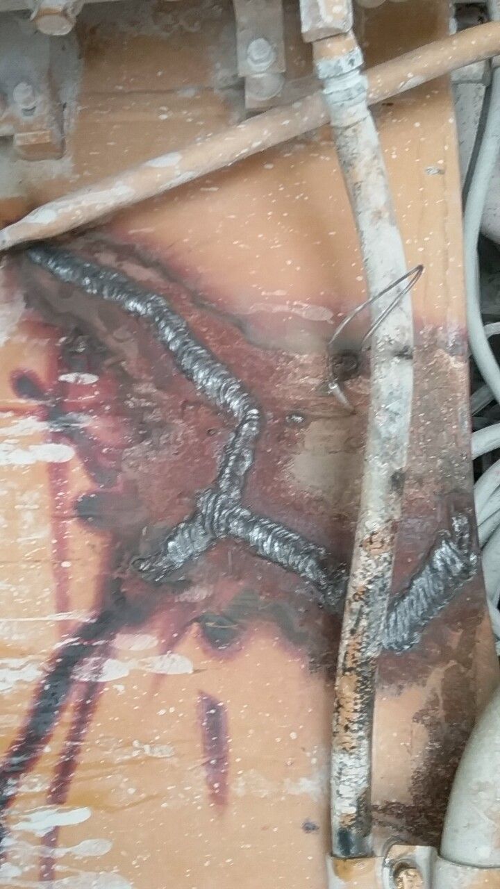 A close up of a piece of metal with welding on it.