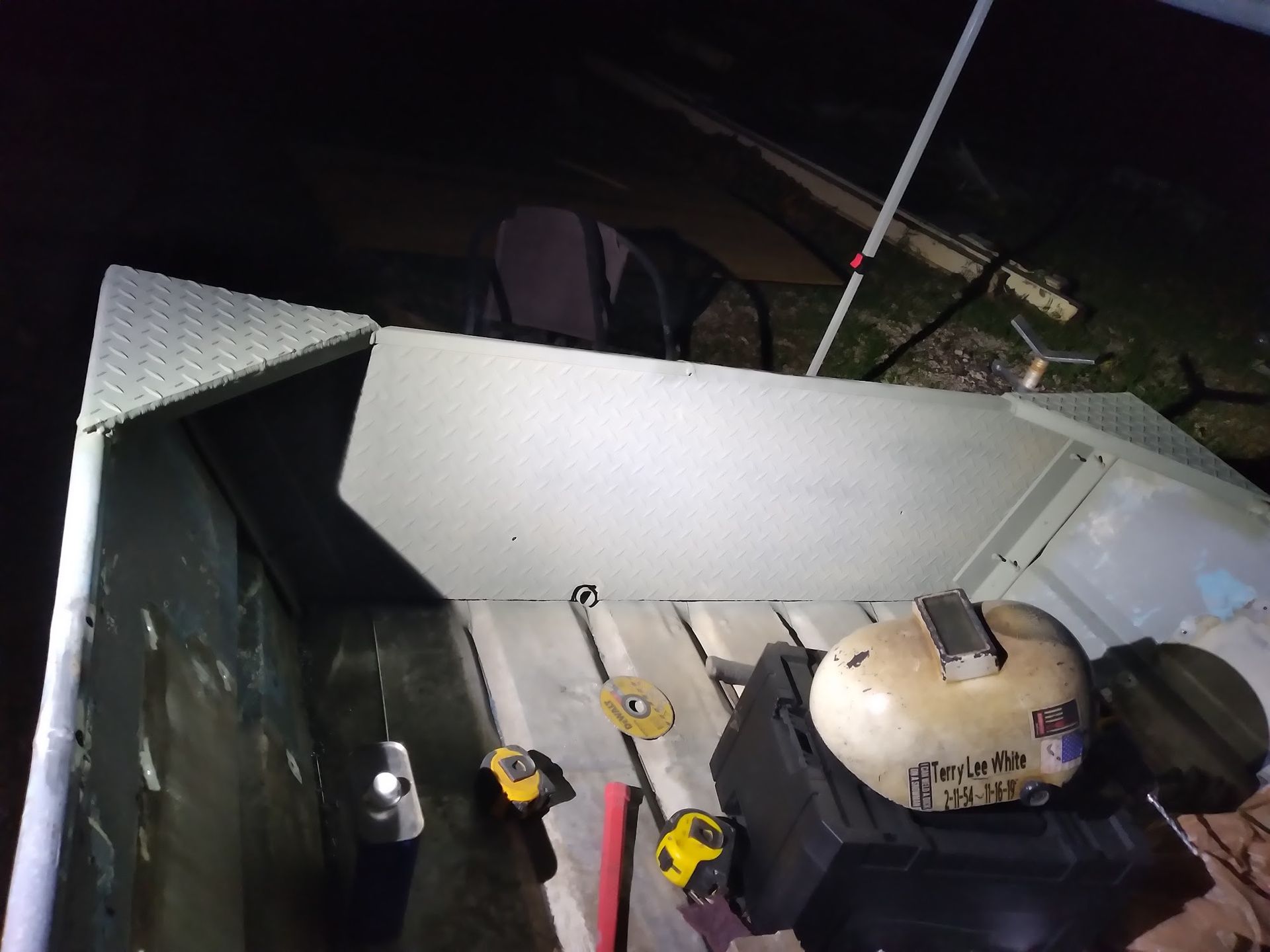 A helmet is sitting on the back of a boat