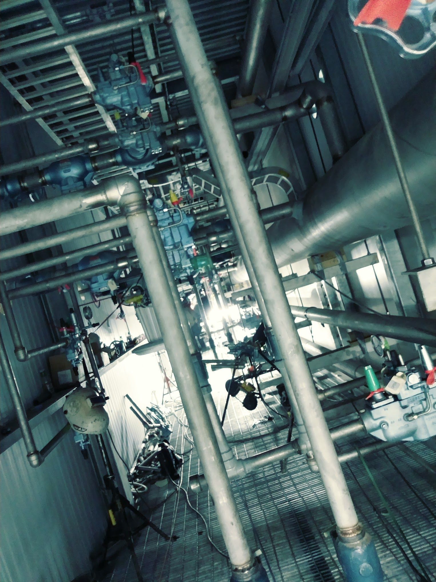 A factory with a lot of pipes and valves