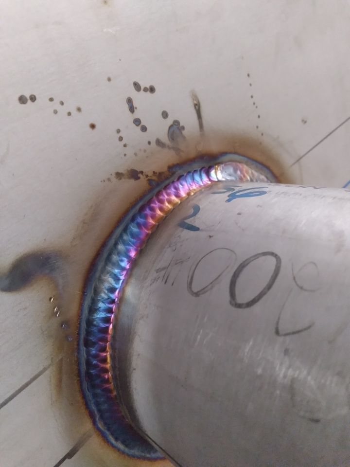 A close up of a welding joint with the number 200 written on it