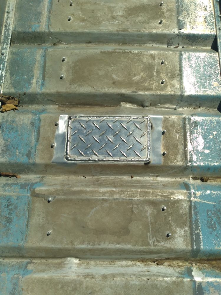A metal roof with a diamond plate on it.