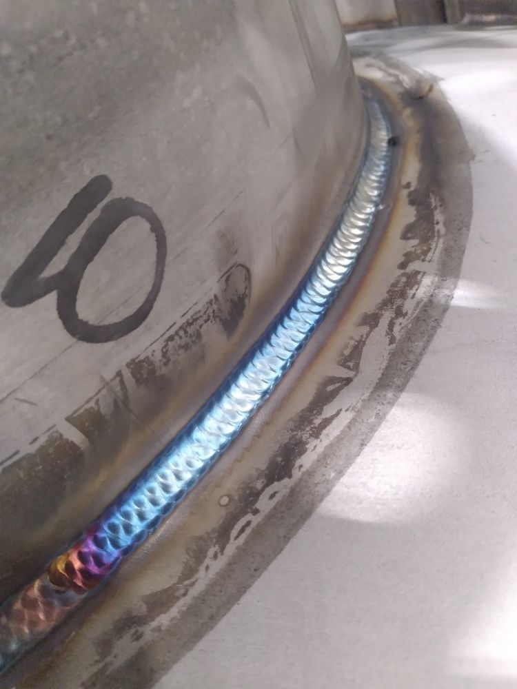 A close up of a welding joint on a metal object.