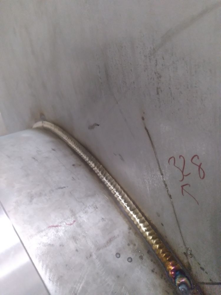 A close up of a welding joint on a metal surface.