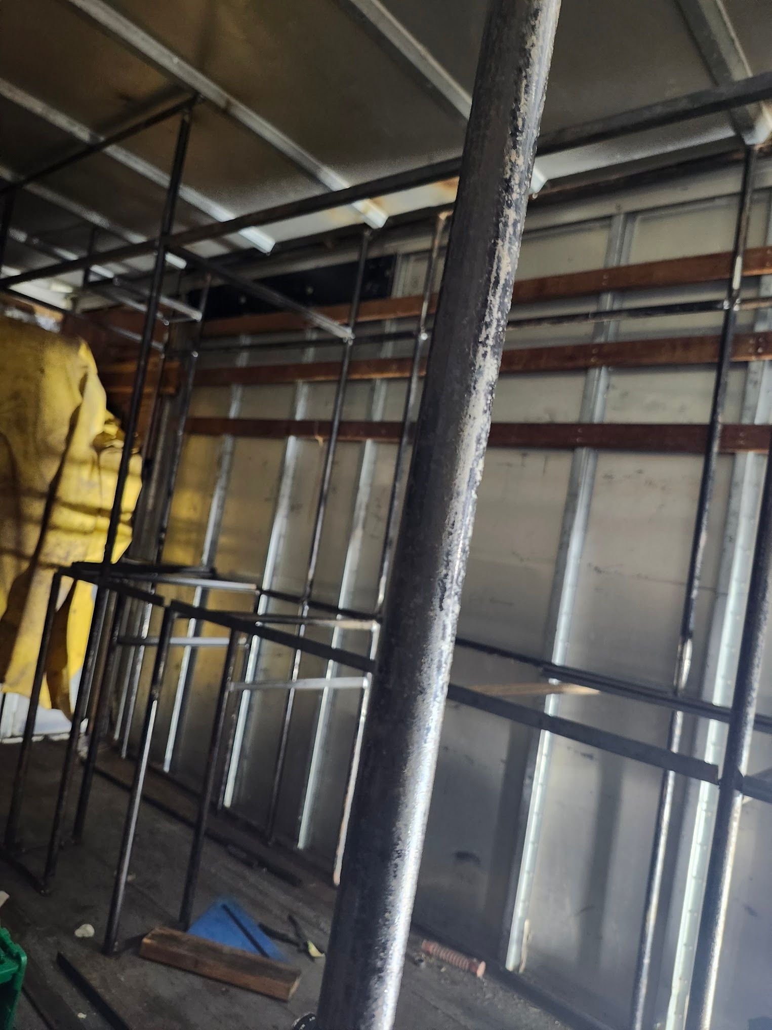 A room with a lot of metal scaffolding on it