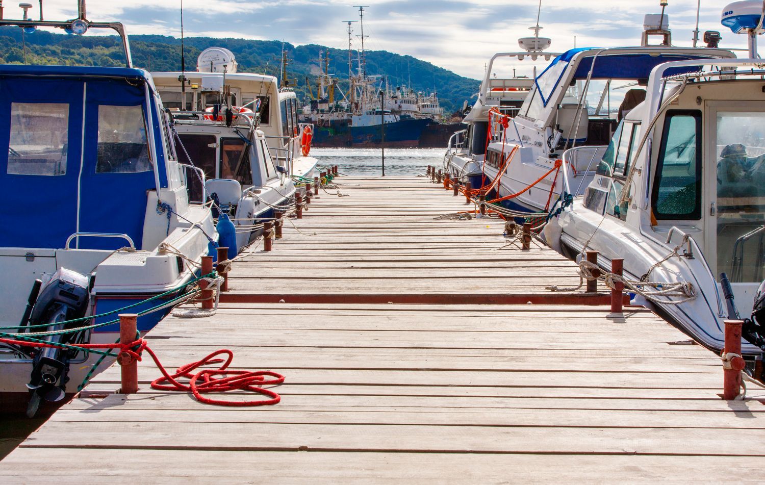 A boat is docked on a dock next to a house