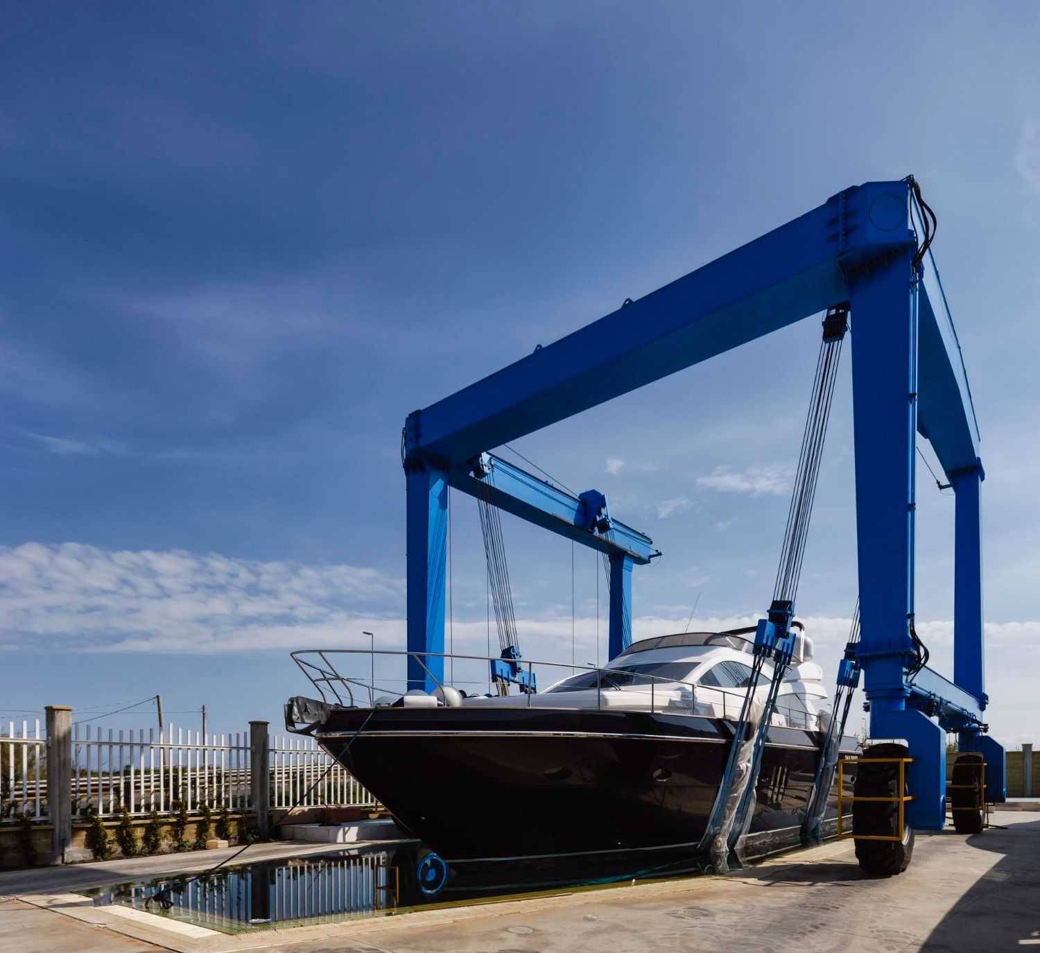 A boat is docked on a dock next to a house