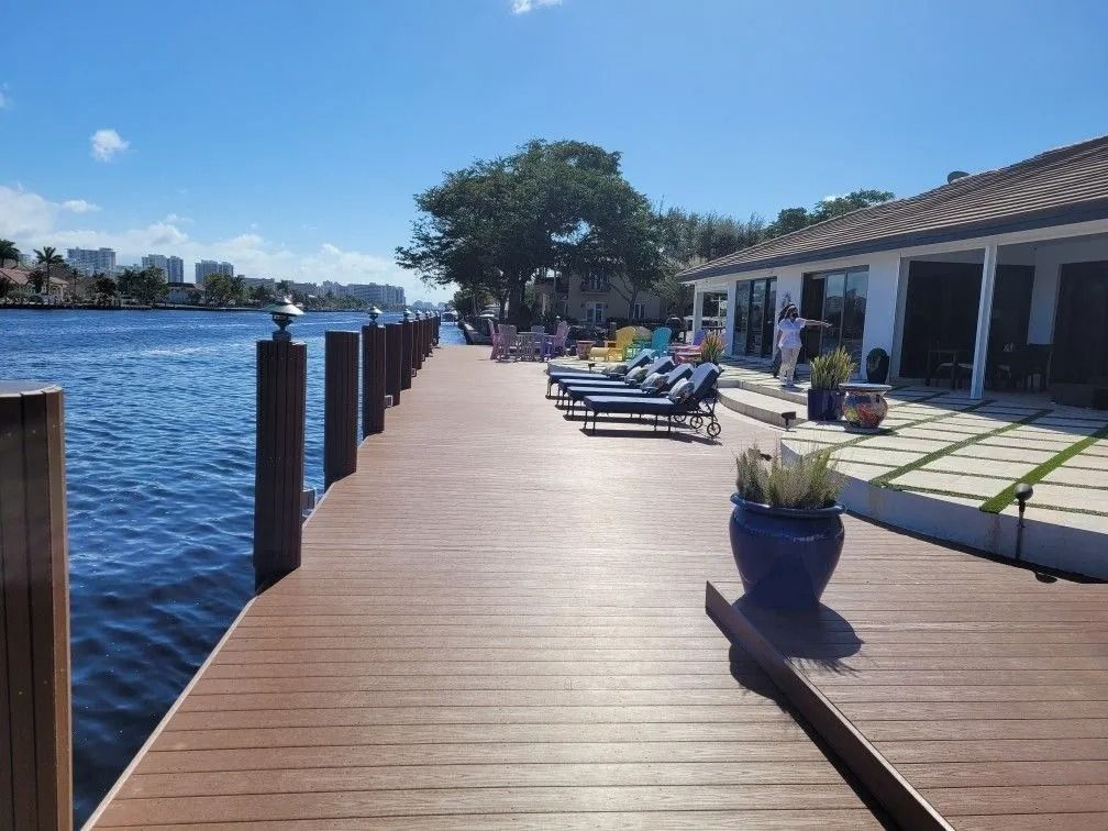 A wooden dock with stairs leading to a lake