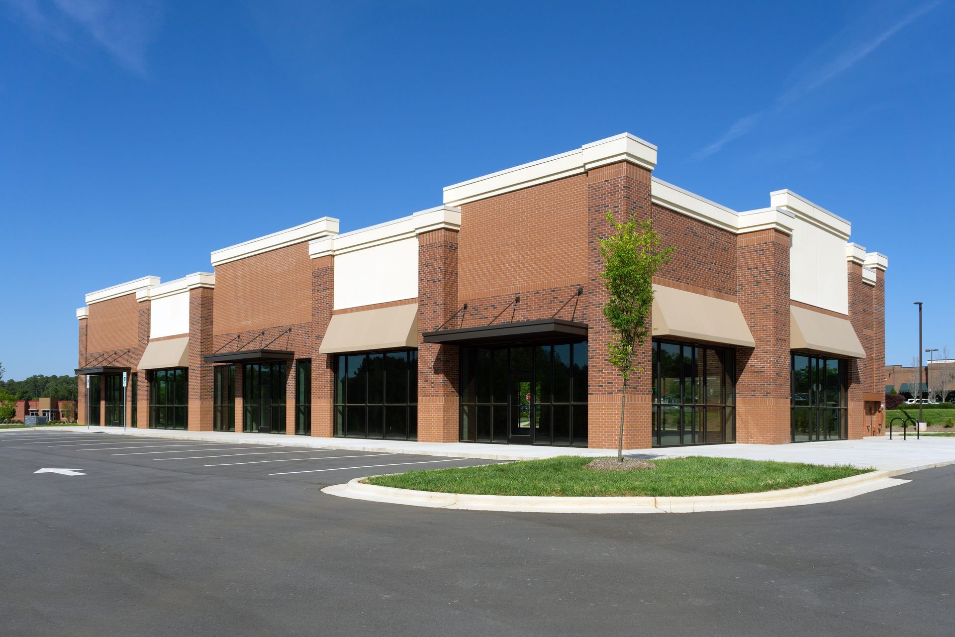 A brick building with a lot of windows and awnings