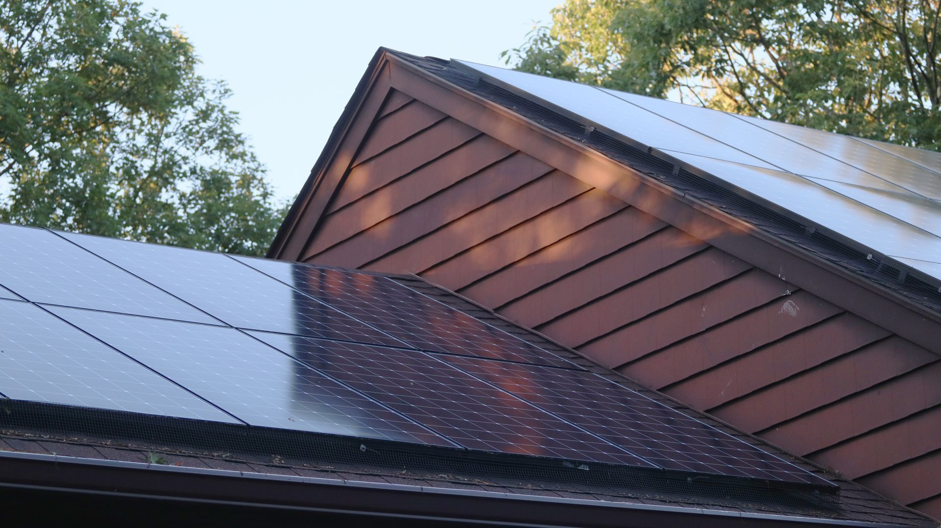 A roof with a lot of solar panels on it