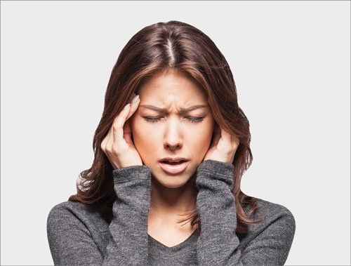 Young woman having a headache