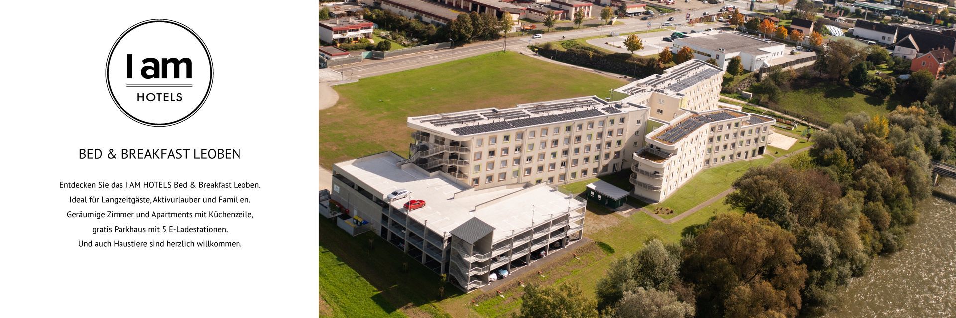 I AM HOTELS Bed & Breakfast Leoben als Luftbild - ein großer Hotelkomplex in Leoben