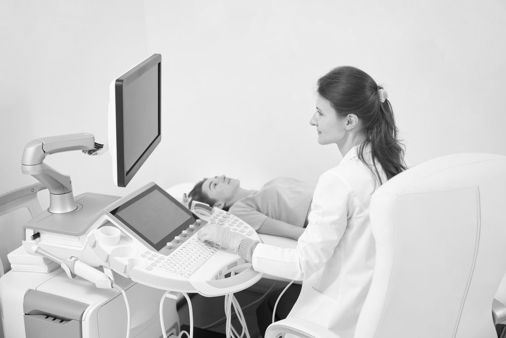 A female is getting an ultrasound before an abortion.