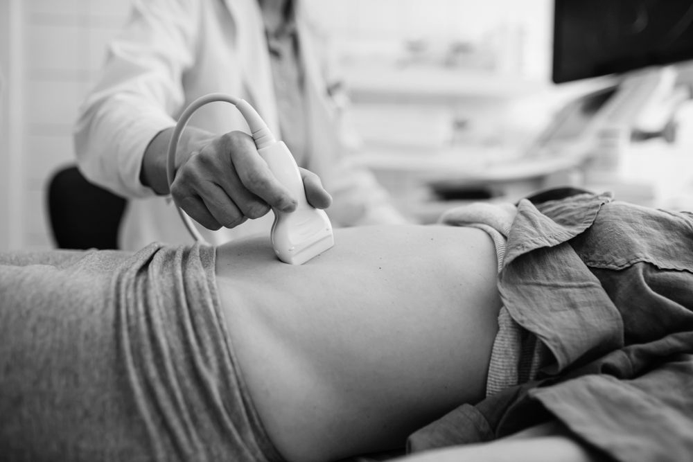 A female is getting an ultrasound before an abortion.